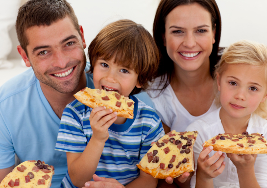 Family enjoying pizza