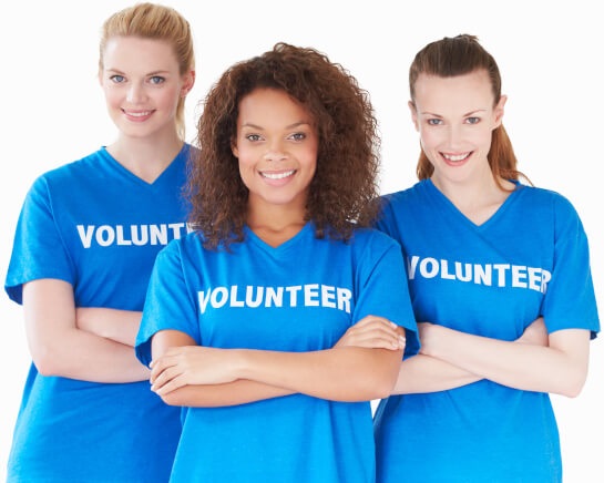 Moms wearing volunteer shirts