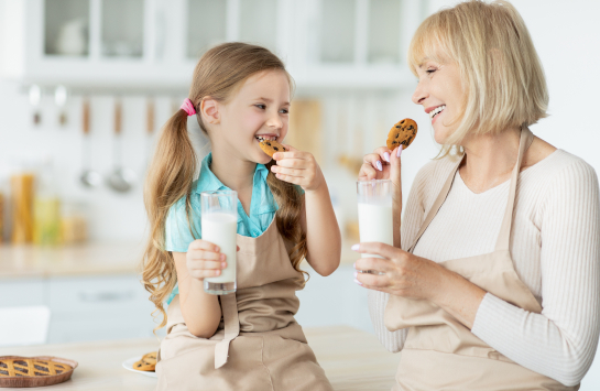 Mother and daughter enjoying cookies