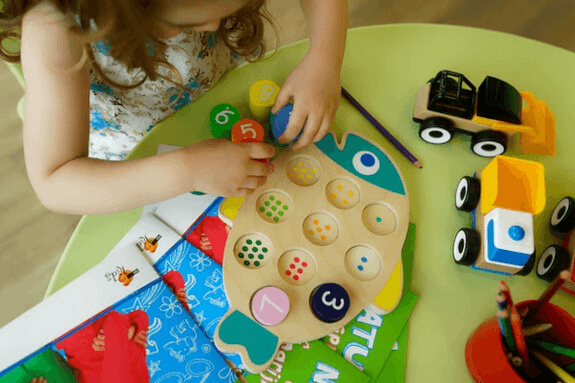 Preschool student solving puzzle