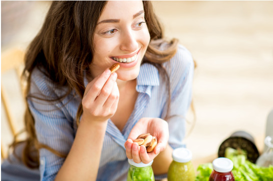 Woman Eating Nuts