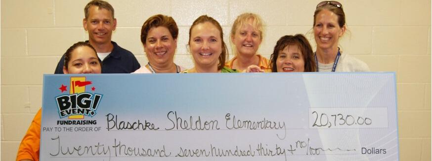Blaschke Sheldon Estates Elementary School fundraising team holding check