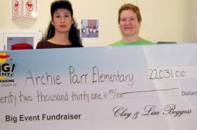 Archie Parr Elementary School fundraising team holding check