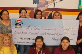 Le Noir Elementary School fundraising team holding check