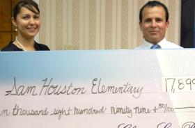 Sam Houston Elementary School fundraising team holding check